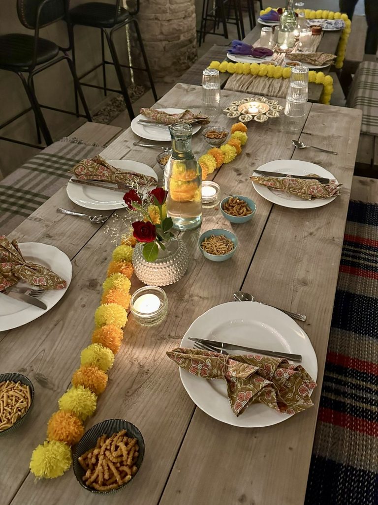 Long dining table arranged for a private dinner