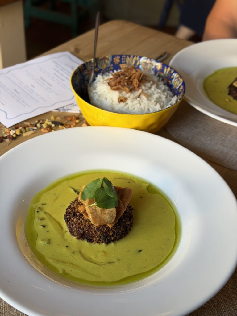 Gourmet soup served in a bowl with fresh garnish