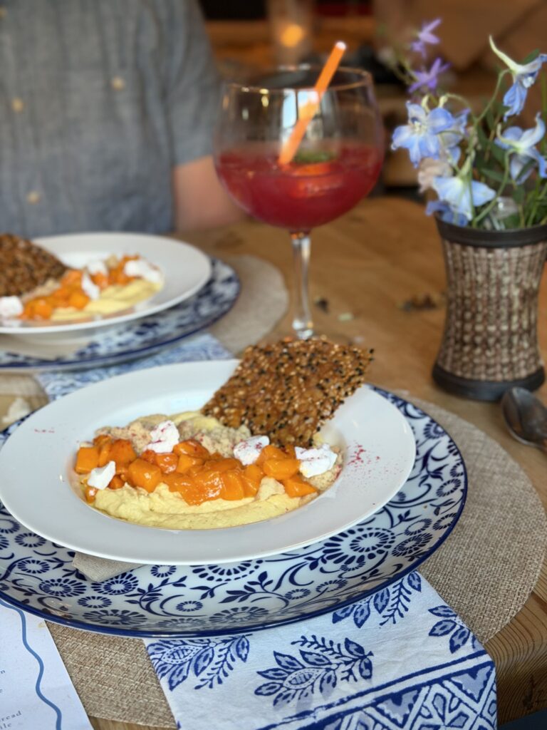 Gourmet plated dish served with a refreshing drink